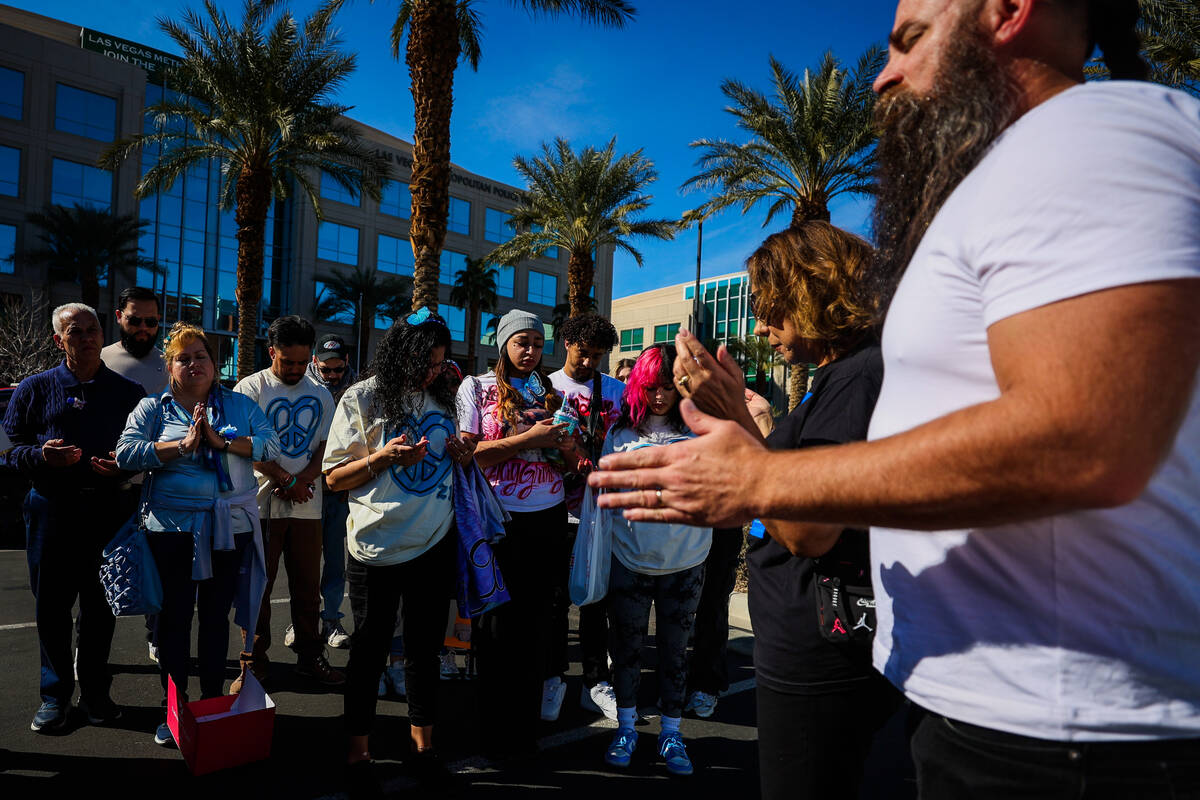 Demonstrators pray during a demonstration for Tabatha Tozzi at Metro Headquarters Sunday, Feb. ...
