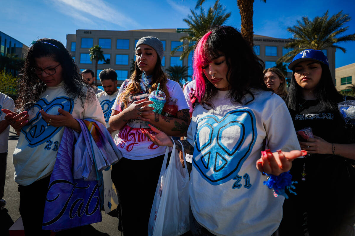 Demonstrators pray during a demonstration for Tabatha Tozzi at Metro Headquarters Sunday, Feb. ...