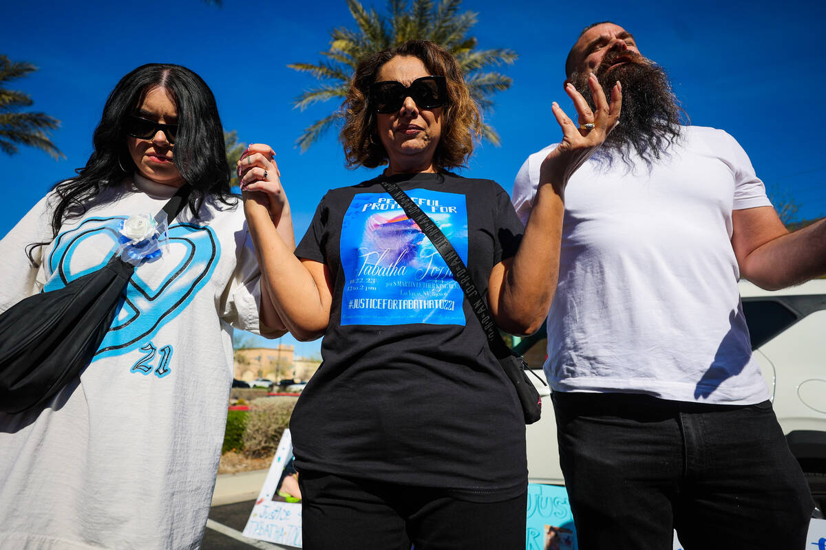 Regina Lacerda, middle, prays during a demonstration for her daughter, Tabatha Tozzi, at Metro ...