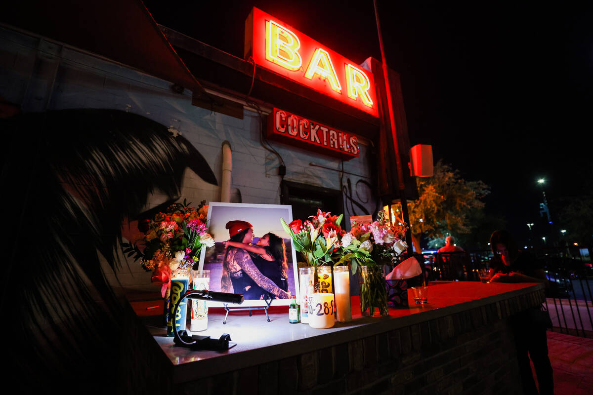 Flowers and candles are left out during a fundraiser in memory of Hope Ritter, a bartender at A ...
