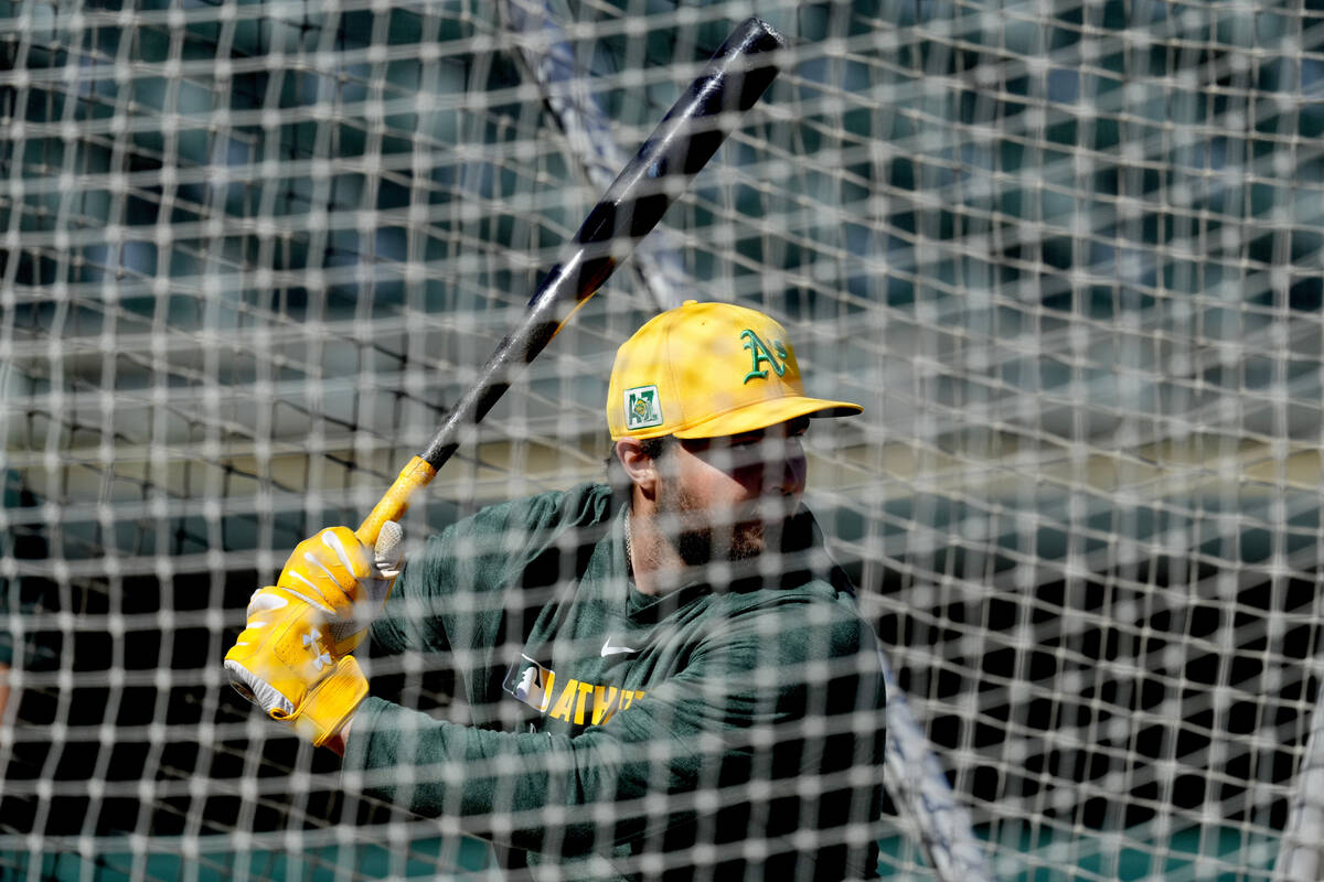 Athletics' Shea Langeliers hits during a spring training baseball workout, Friday, Feb. 21, 202 ...