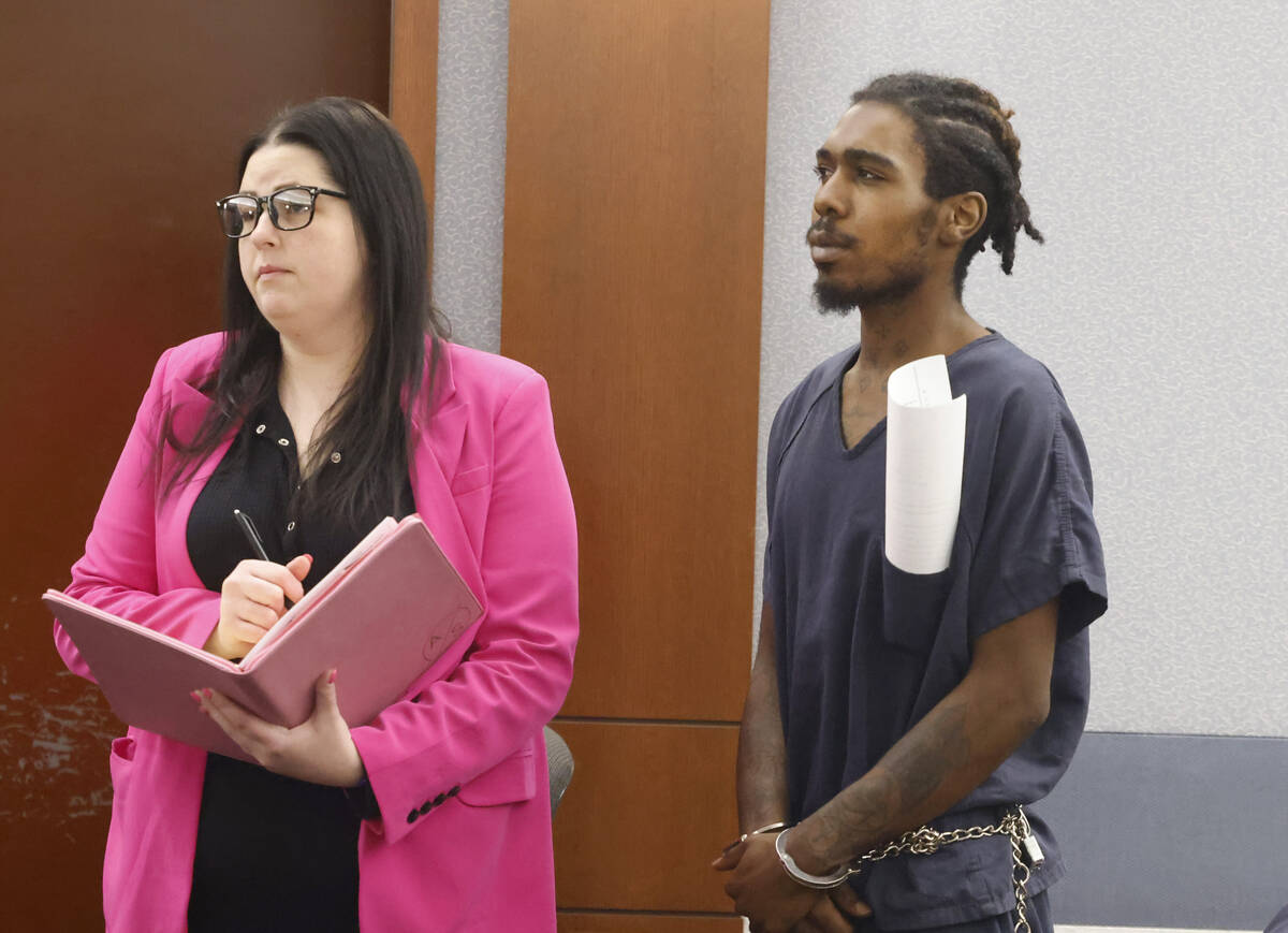 Tajon Walker, one of the three defendants in a 2021 bus stop killing, appears in court with his ...
