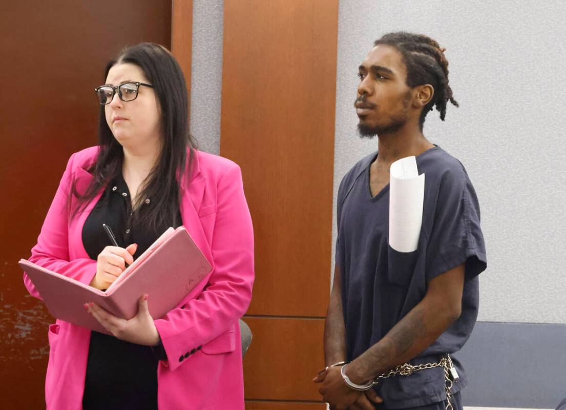 Tajon Walker, one of the three defendants in a 2021 bus stop killing, appears in court with his ...