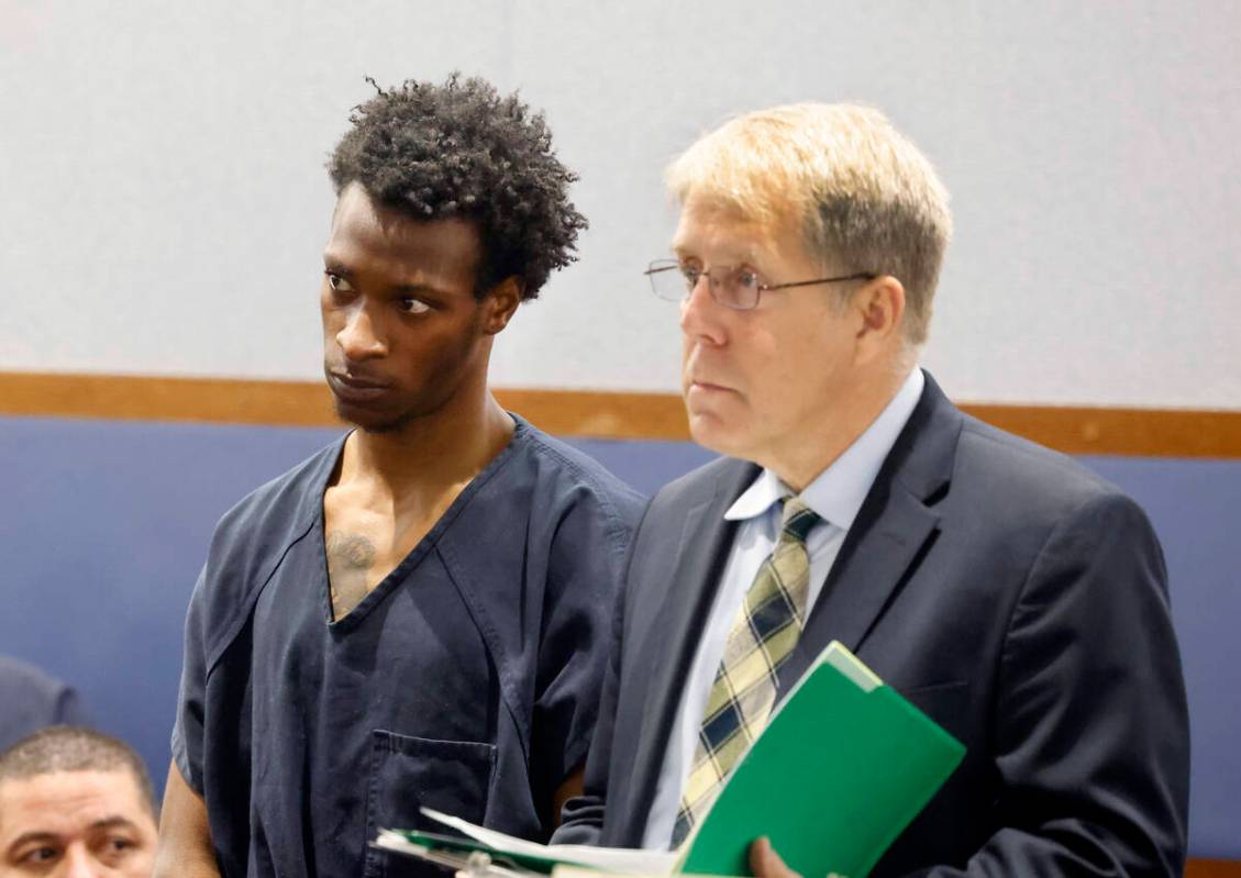 Alexander Hinton, one of the three defendants in a 2021 bus stop killing, appears in court with ...