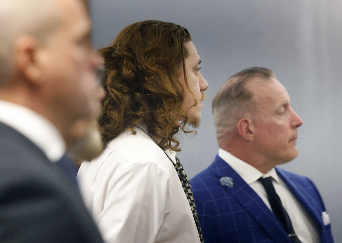 Cristobal Perez, center, one of the suspects in the fatal shooting of two homeless people, appe ...