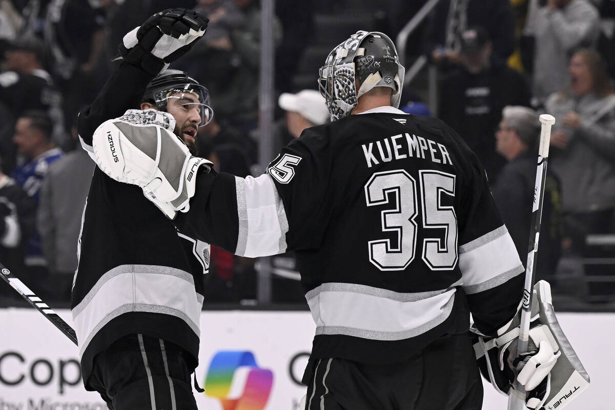 Los Angeles Kings defenseman Drew Doughty (8) celebrates with goaltender Darcy Kuemper (35) aft ...