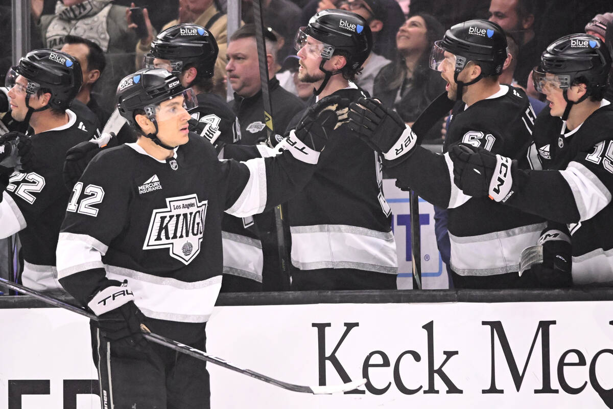 Los Angeles Kings left wing Trevor Moore (12) celebrates with teammates after scoring against t ...