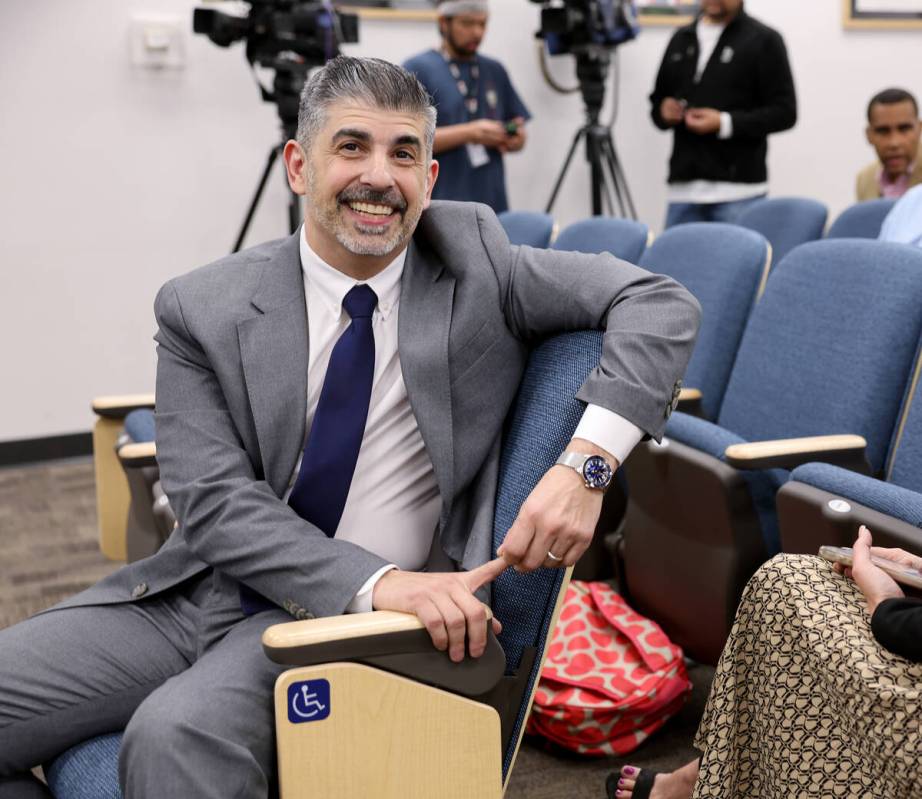 John Anzalone visits with members of the audience before answering questions from the Clark Cou ...