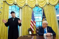 President Donald Trump listens as Elon Musk speaks in the Oval Office at the White House, Tuesd ...