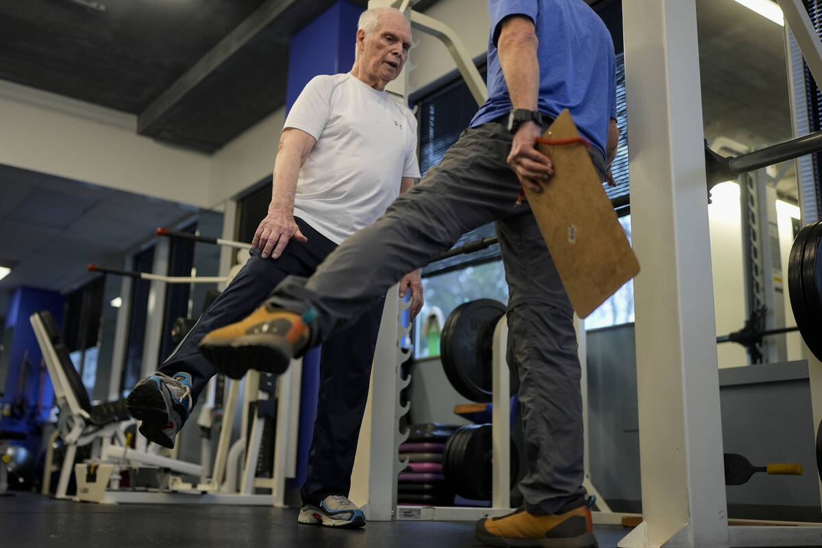 Dr. Grover Smith, left, works out with exercise scientist Dr. Irv Rubenstein, right, at STEPS F ...