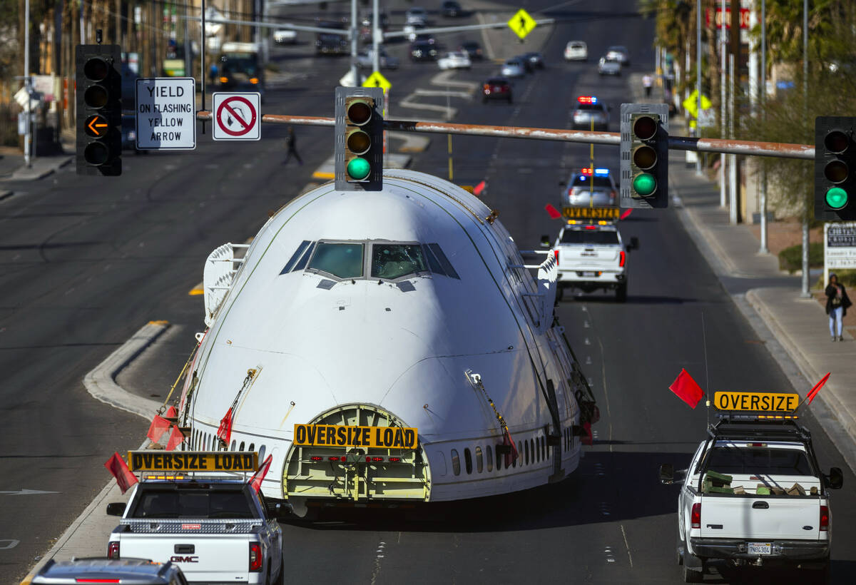 A decommissioned 747 fuselage section is transported along East Cheyenne Avenue to the expanded ...