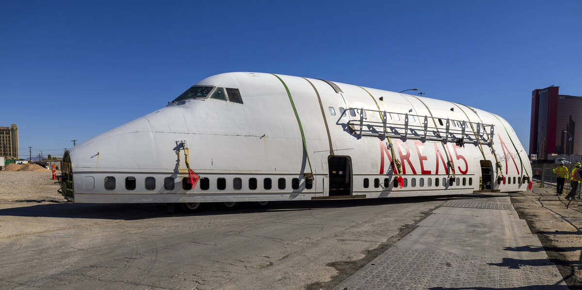 A decommissioned 747 fuselage section is backed in after being transported along Meade Avenue f ...