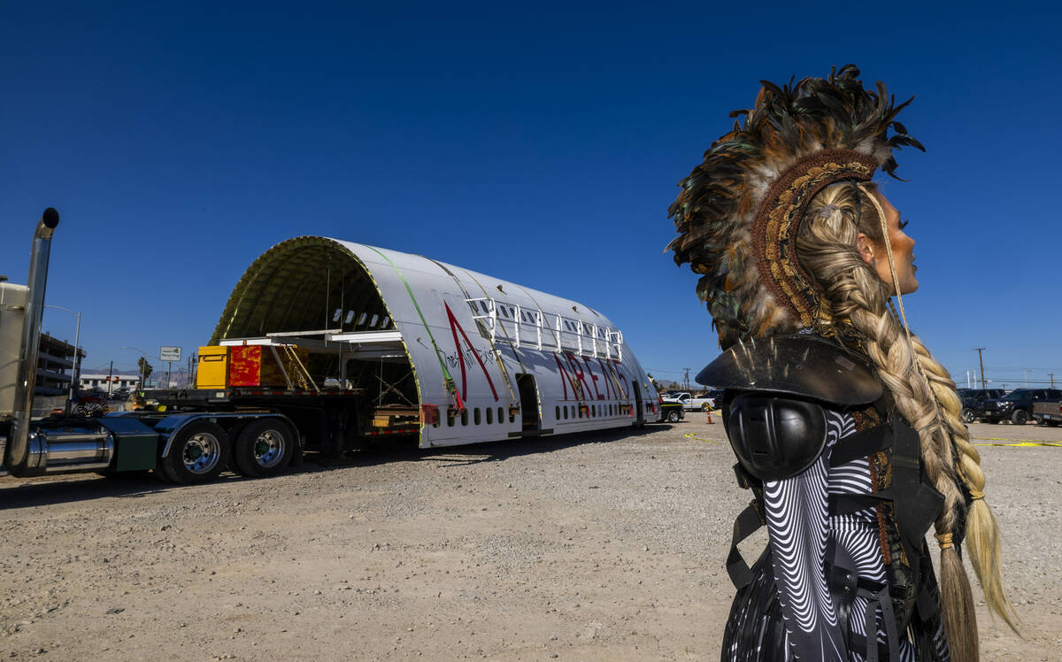Area15 model Kasey Perlinger stands near a decommissioned 747 fuselage section now placed among ...