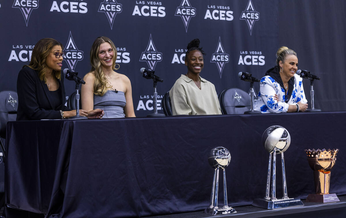 Aces President Nikki Fargas speaks as Elizabeth Kitley, Jewell Loyd and head coach Becky Hammon ...