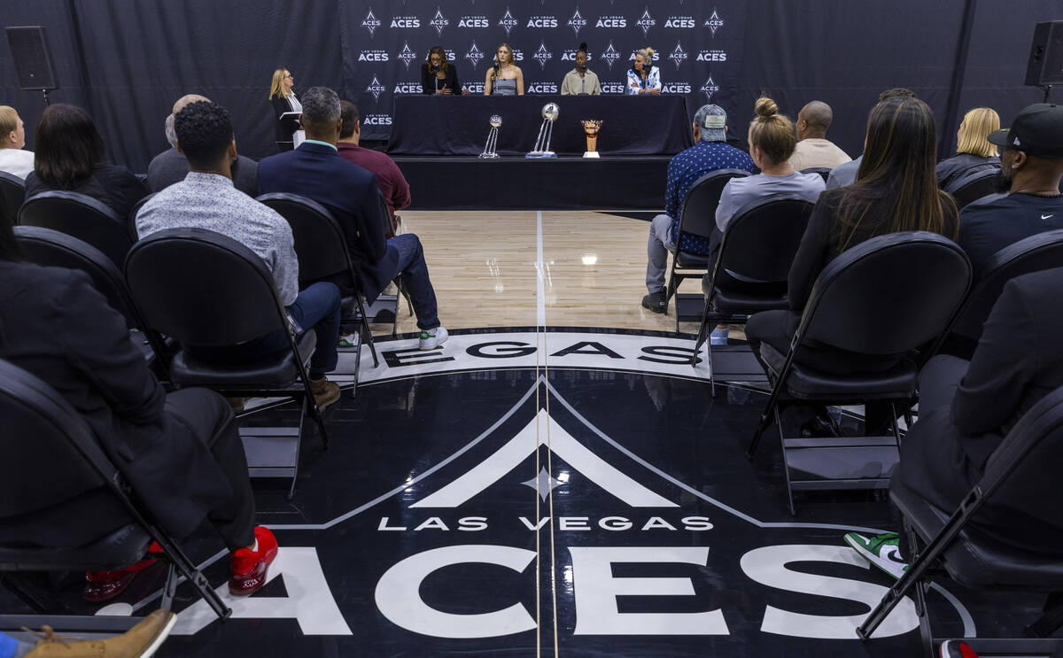 Aces President Nikki Fargas speaks as Elizabeth Kitley, Jewell Loyd and head coach Becky Hammon ...