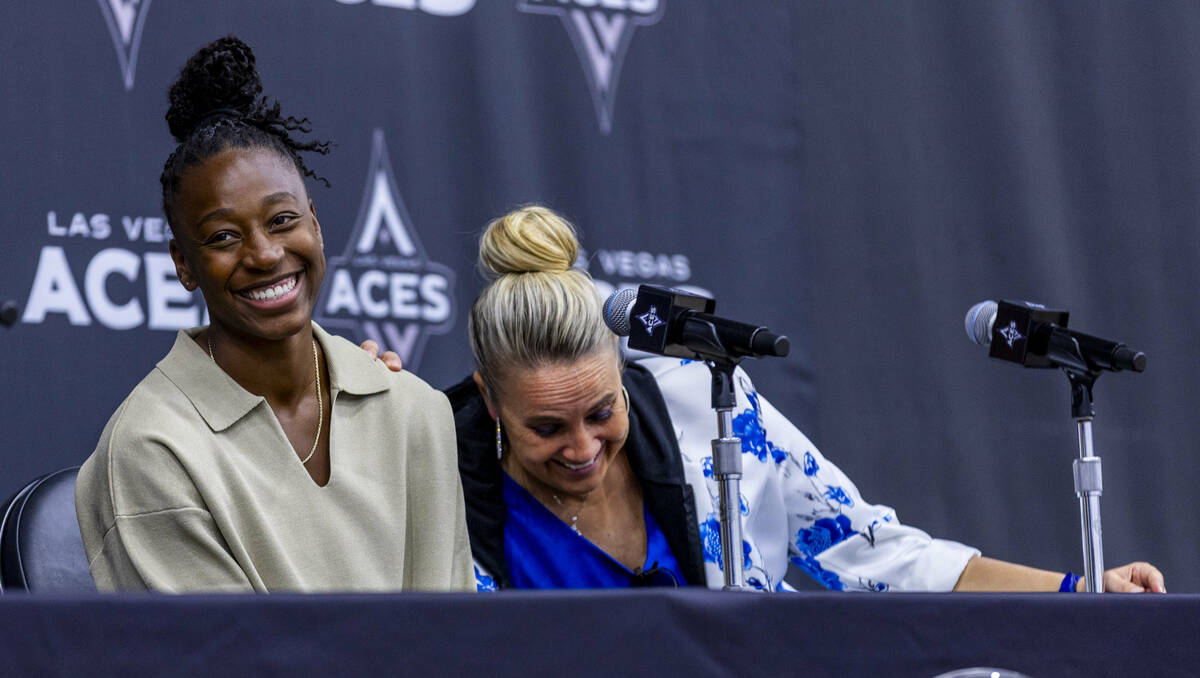 Aces Jewell Loyd laughs with head coach Becky Hammon as they address reporters for first time t ...