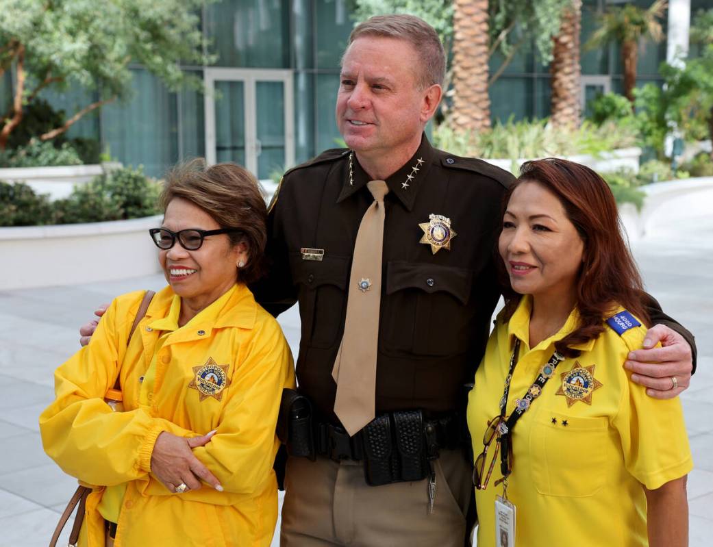 Clark County Sheriff Kevin McMahill Las Vegas poses for a photo with police volunteers Jo Steir ...