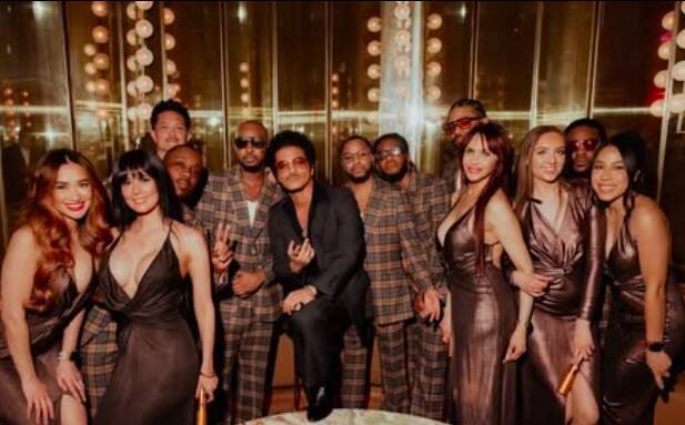 Bruno Mars is shown with members of the Hooligans and first-anniversary guests at The Pinky Rin ...