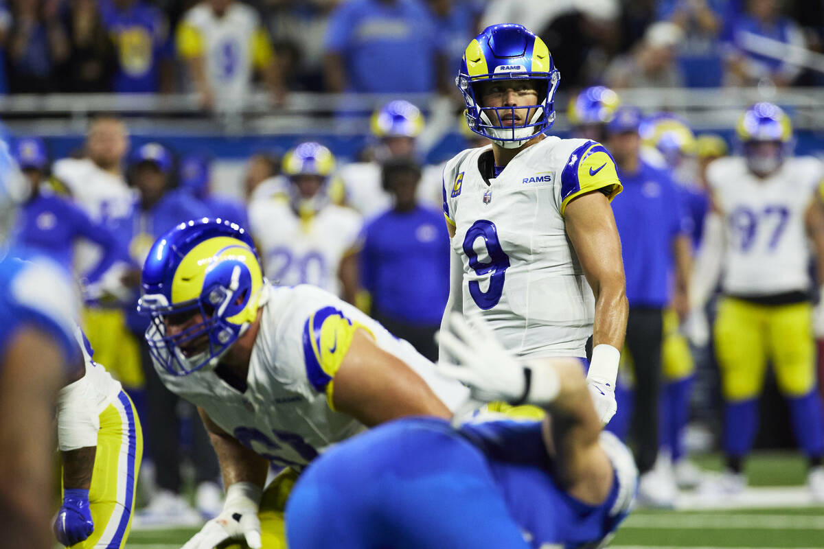 Los Angeles Rams quarterback Matthew Stafford (9) gets set to run a play against the Detroit Li ...