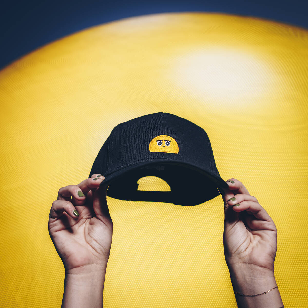 Sphere’s new e-commerce shop is selling merchandise featuring Orbi, the yellow emoji that's b ...