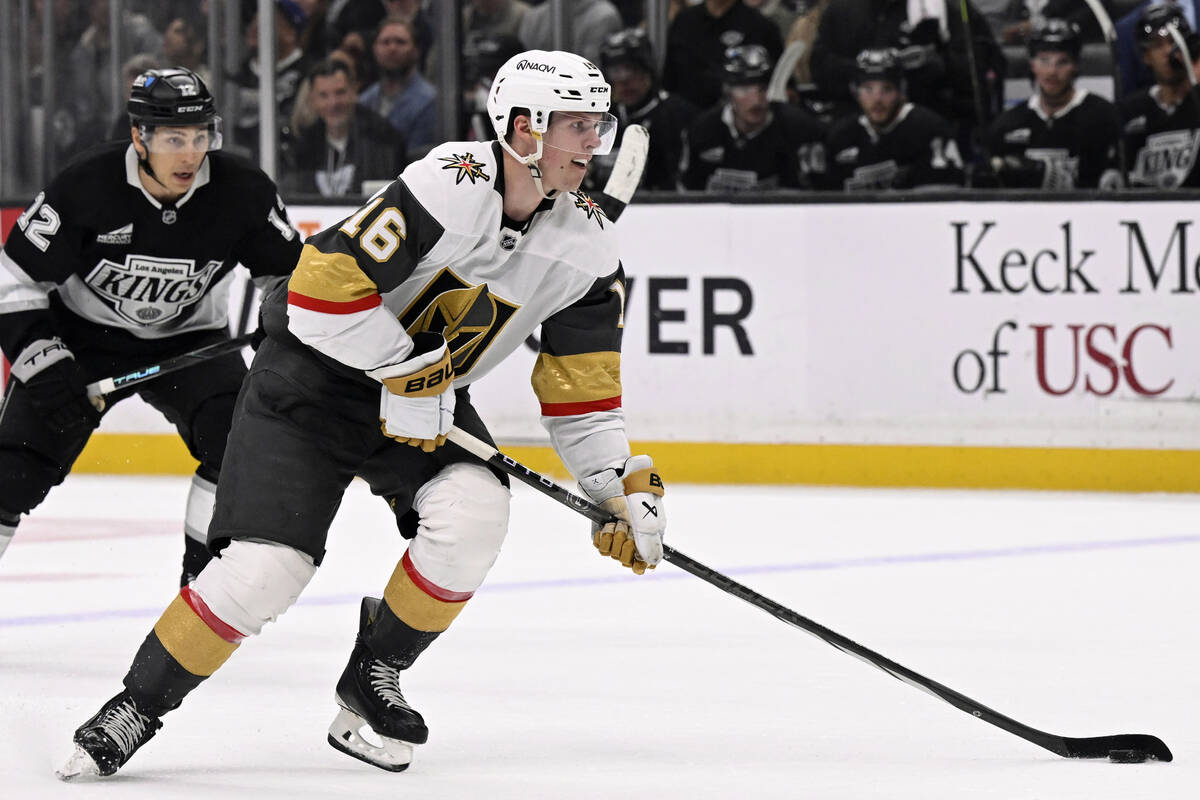 Vegas Golden Knights left wing Pavel Dorofeyev (16) controls the puck with pressure from Los An ...