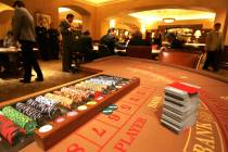 Chips and cards are shown on a baccarat table in the high-roller VIP baccarat room at the MGM G ...