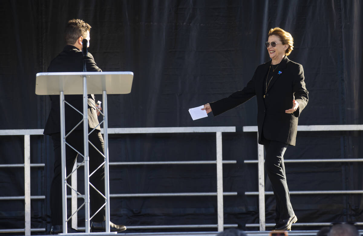 Annette Bening, chair of the Entertainment Community Fund, right, greets Mark Shunock, owner of ...