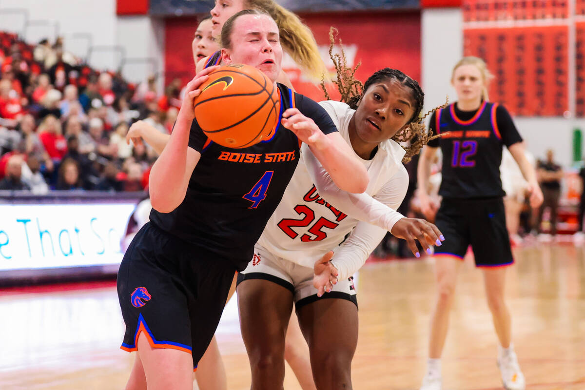 Lady Rebels guard Aaliyah Alexander (25) tries to swipe the ball from Boise State Broncos guard ...