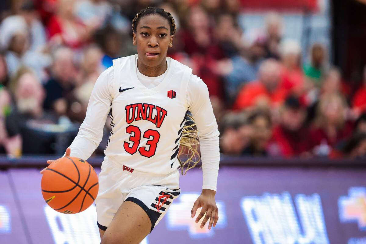 Lady Rebels guard Amarachi Kimpson (33) dribbles the ball during an NCAA women’s basketb ...