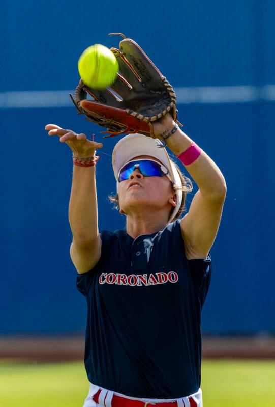 Coronado outfielder Caleigh Burns (4) looks in a pop fly against a Douglas batter during secon ...