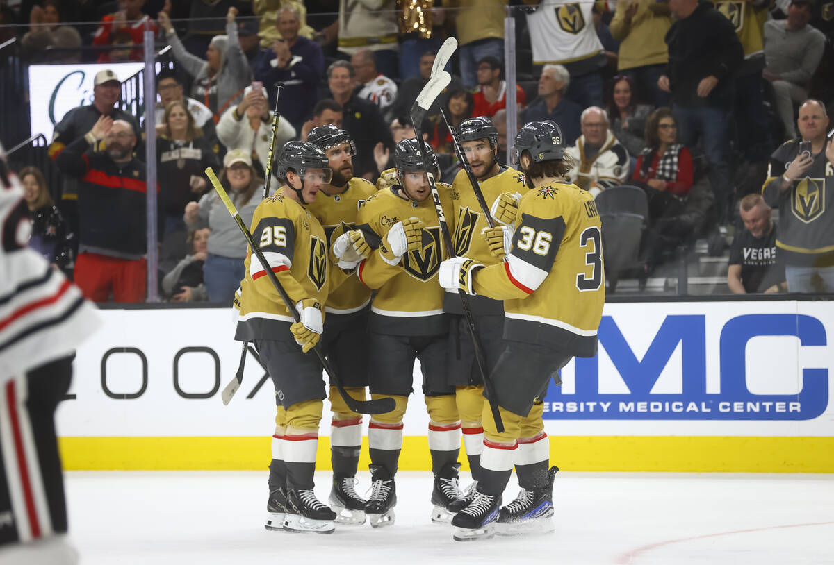 The Golden Knights celebrate after a goal against the Chicago Blackhawks during the first perio ...