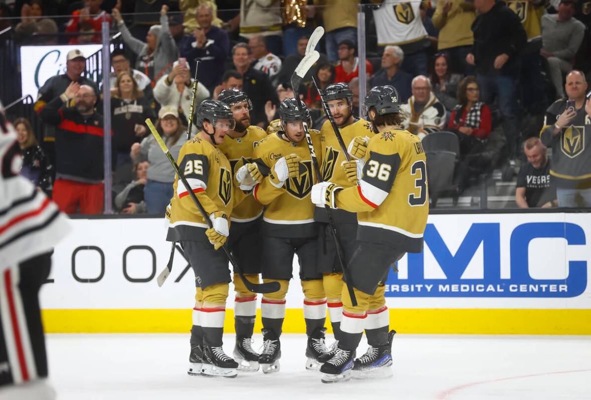 The Golden Knights celebrate after a goal against the Chicago Blackhawks during the first perio ...