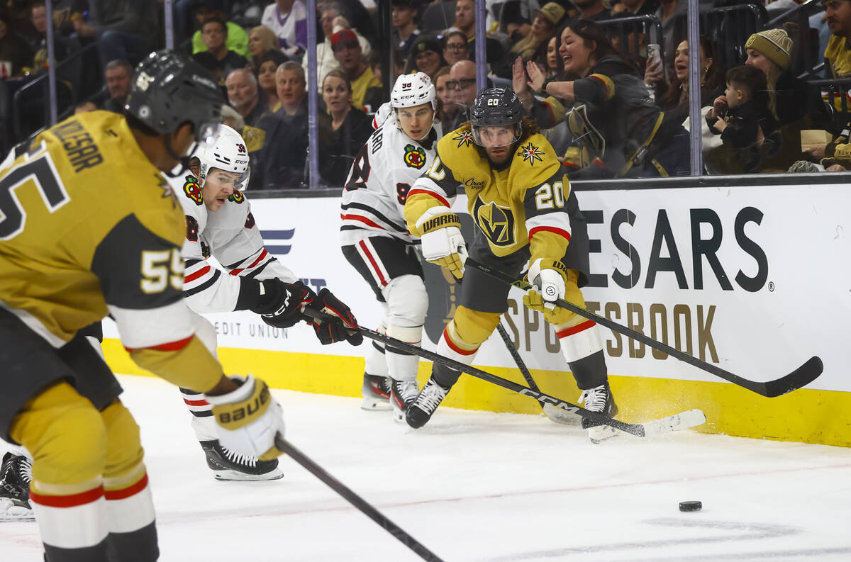 Golden Knights left wing Brandon Saad (20) passes the puck to Golden Knights right wing Keegan ...