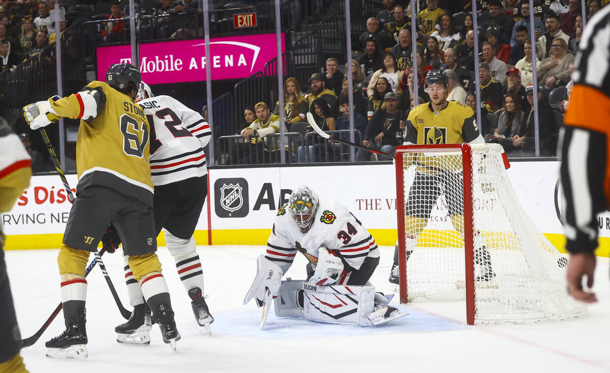 Chicago Blackhawks goaltender Petr Mrazek (34) gives up a goal to Golden Knights center Tomas H ...