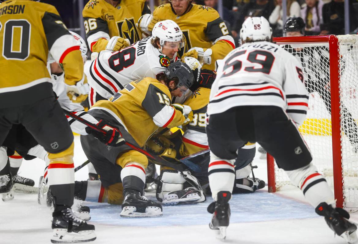 Golden Knights goaltender Ilya Samsonov (35) and defenseman Noah Hanifin (15) stop the puck aga ...