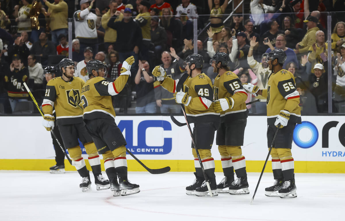 The Golden Knights celebrate a goal against the Chicago Blackhawks during the third period of a ...