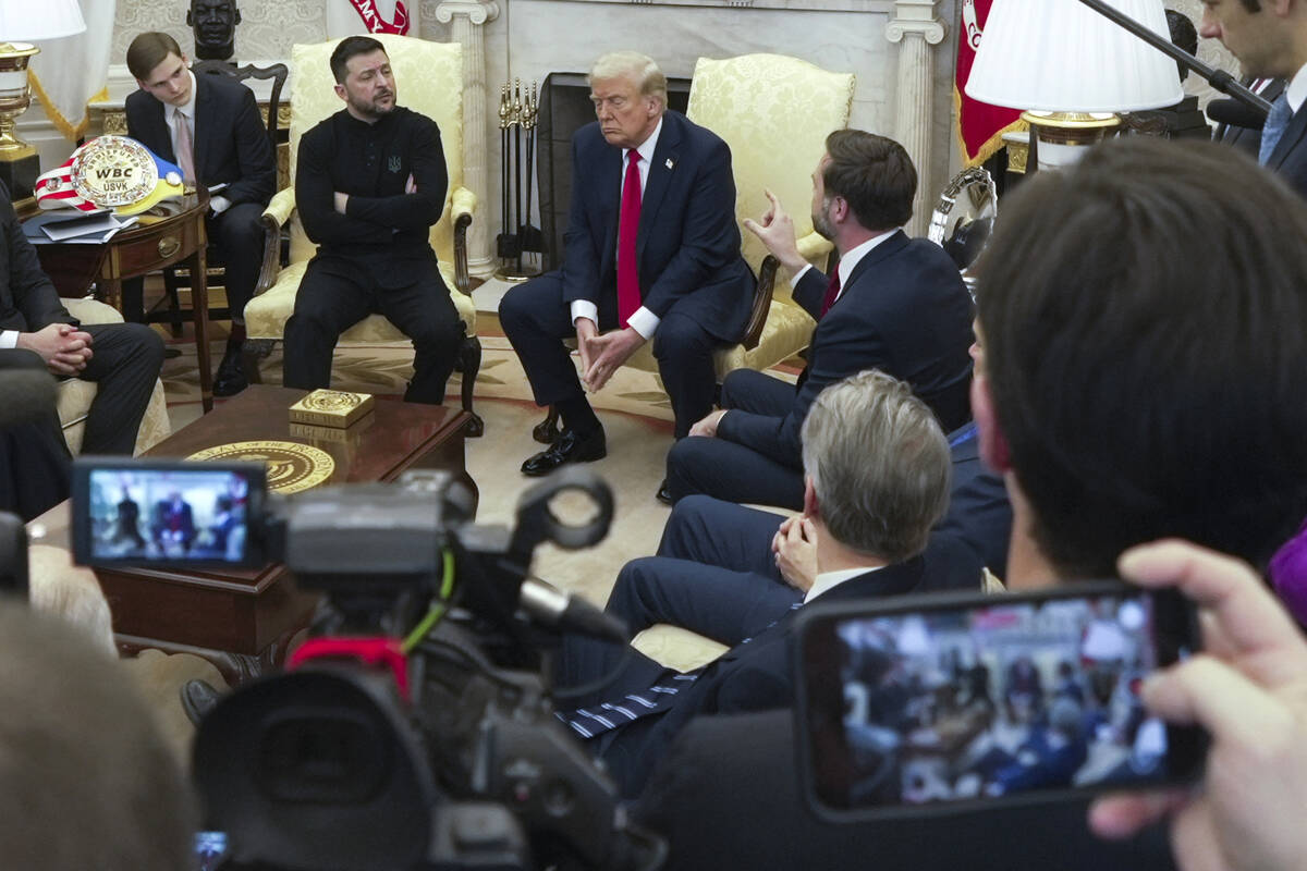 Vice President JD Vance, right, speaks with Ukrainian President Volodymyr Zelenskyy, left, as P ...