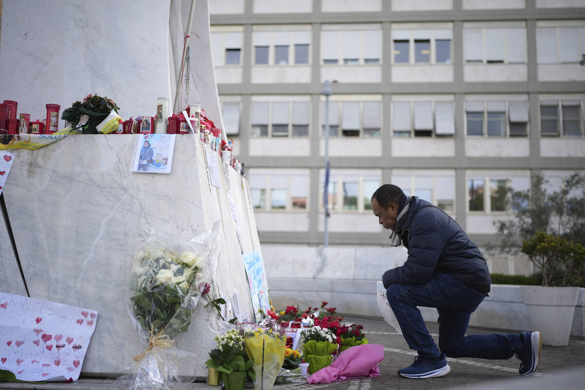A man prays at the Agostino Gemelli Polyclinic, in Rome, Friday, Feb. 28, 2025 where Pope Franc ...
