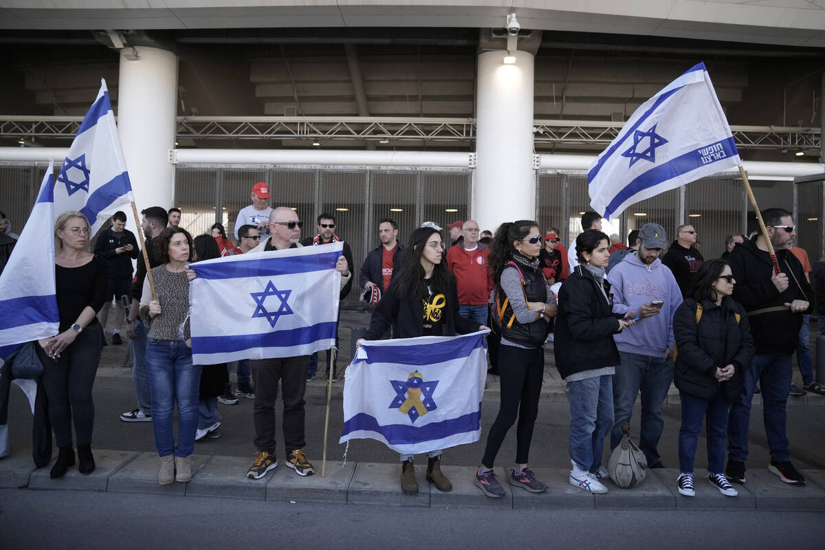Friends, family and soccer fans at a public memorial ceremony for slain hostage Tsachi Idan, a ...