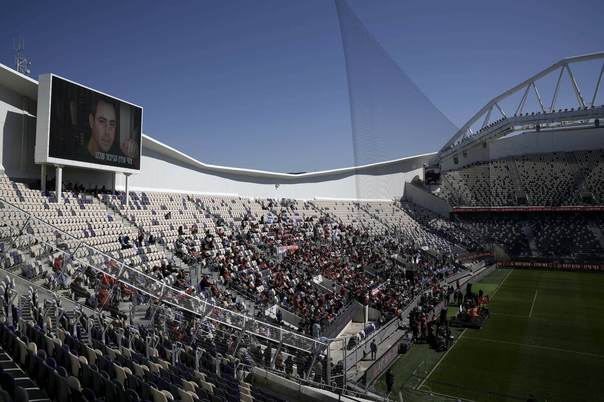 Friends, family and soccer fans attend a public memorial ceremony for slain hostage Tsachi Idan ...