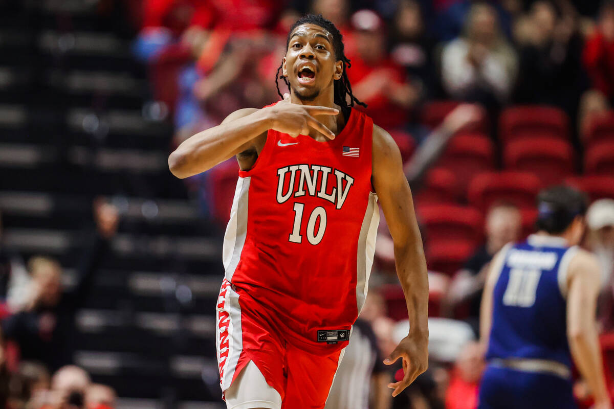 Rebels guard Jaden Henley (10) celebrates a shot during an NCAA men’s basketball game be ...
