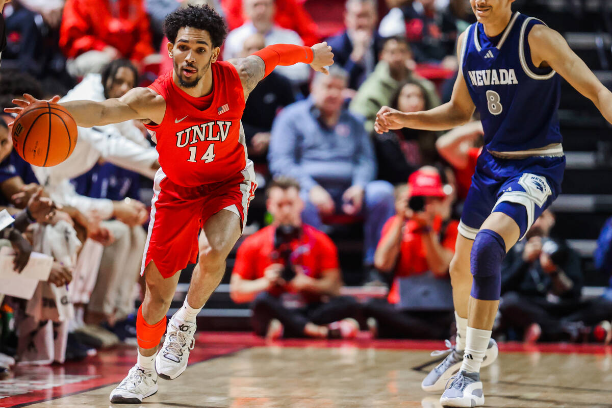 Rebels guard Jailen Bedford (14) rushes to keep the ball from going out of bounds during an NCA ...