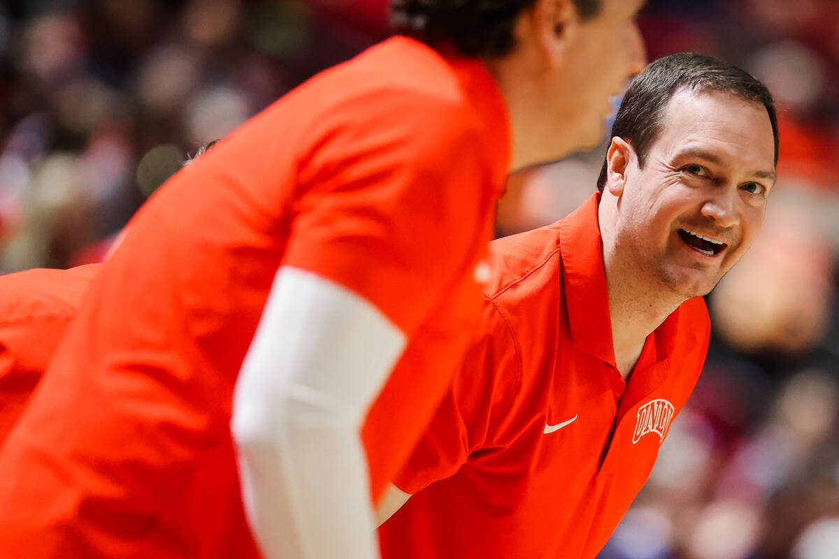 Rebels head coach Kevin Kruger reacts to game action during an NCAA men’s basketball gam ...
