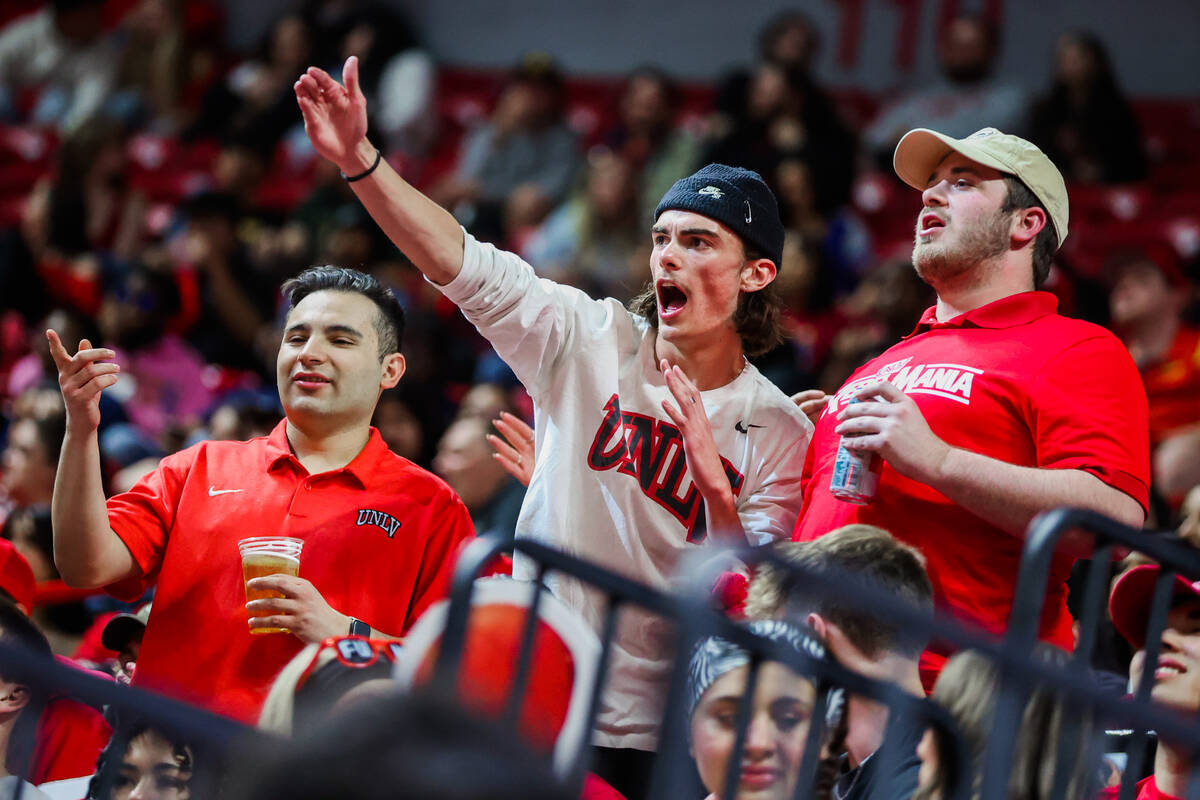 Rebels fans boo the UNR Wolf Pack as they run onto the court to warm up for an NCAA men’ ...