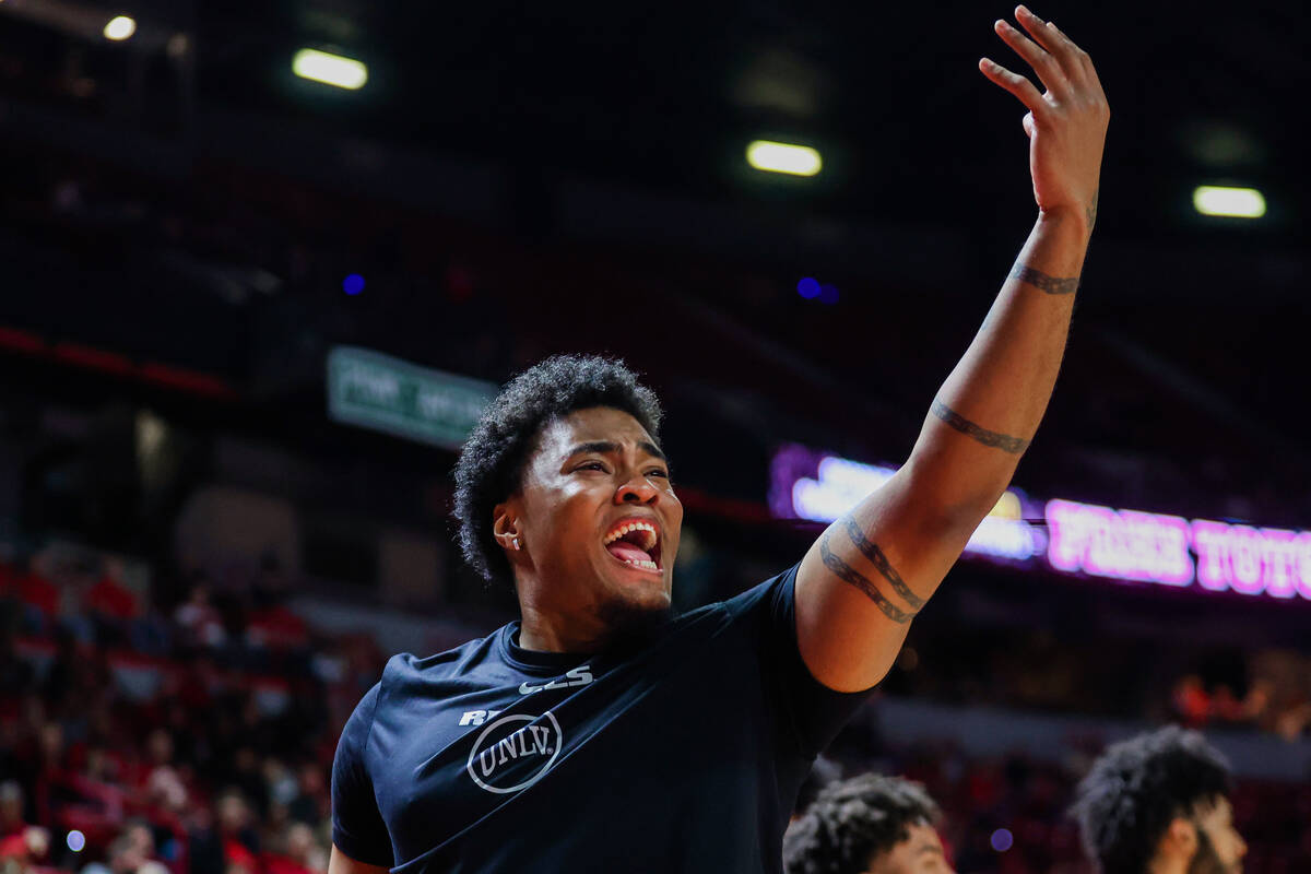 Rebels forward Rob Whaley Jr. cheers for his teammates from the bench during an NCAA men&#x2019 ...