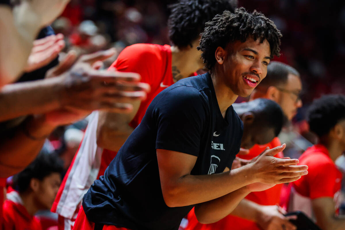Rebels guard Dedan Thomas Jr. (11) cheers for his teammates from the bench during an NCAA men&# ...