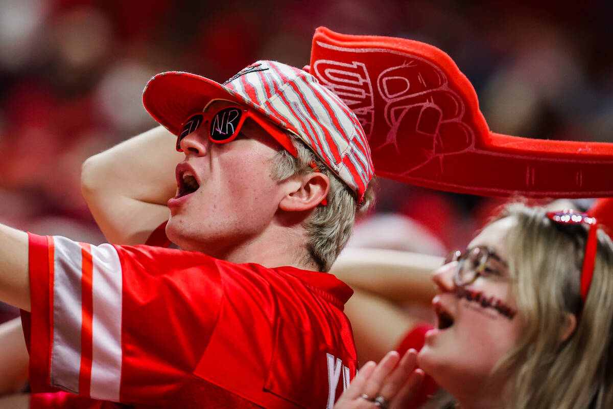 Rebels fans cheer for their team during an NCAA men’s basketball game between UNLV and t ...