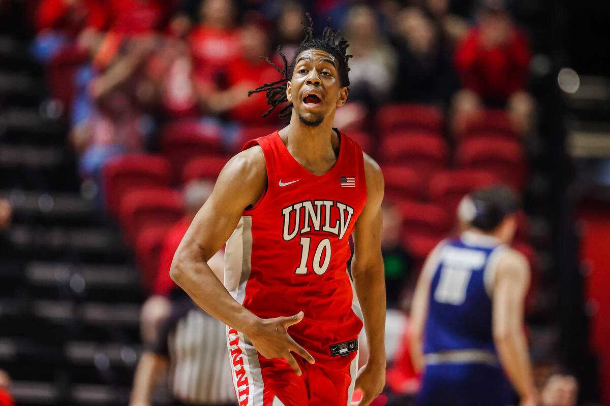 Rebels guard Jaden Henley (10) celebrates a basket during an NCAA men’s basketball game ...