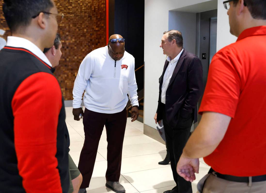 UNLV athletic director Erick Harper, left, chats with football head coach Dan Mullen at Fertitt ...