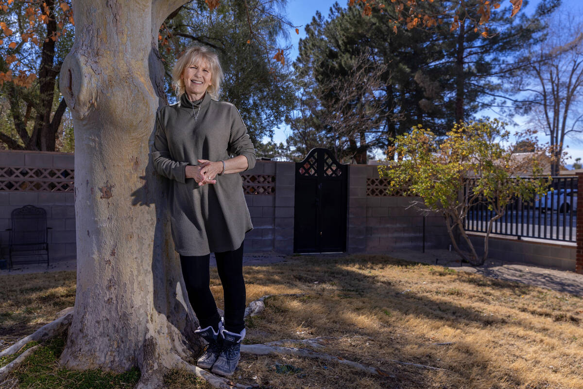 Laura McSwain, president of the Water Fairness Coalition, poses outside her home in the McNeil ...